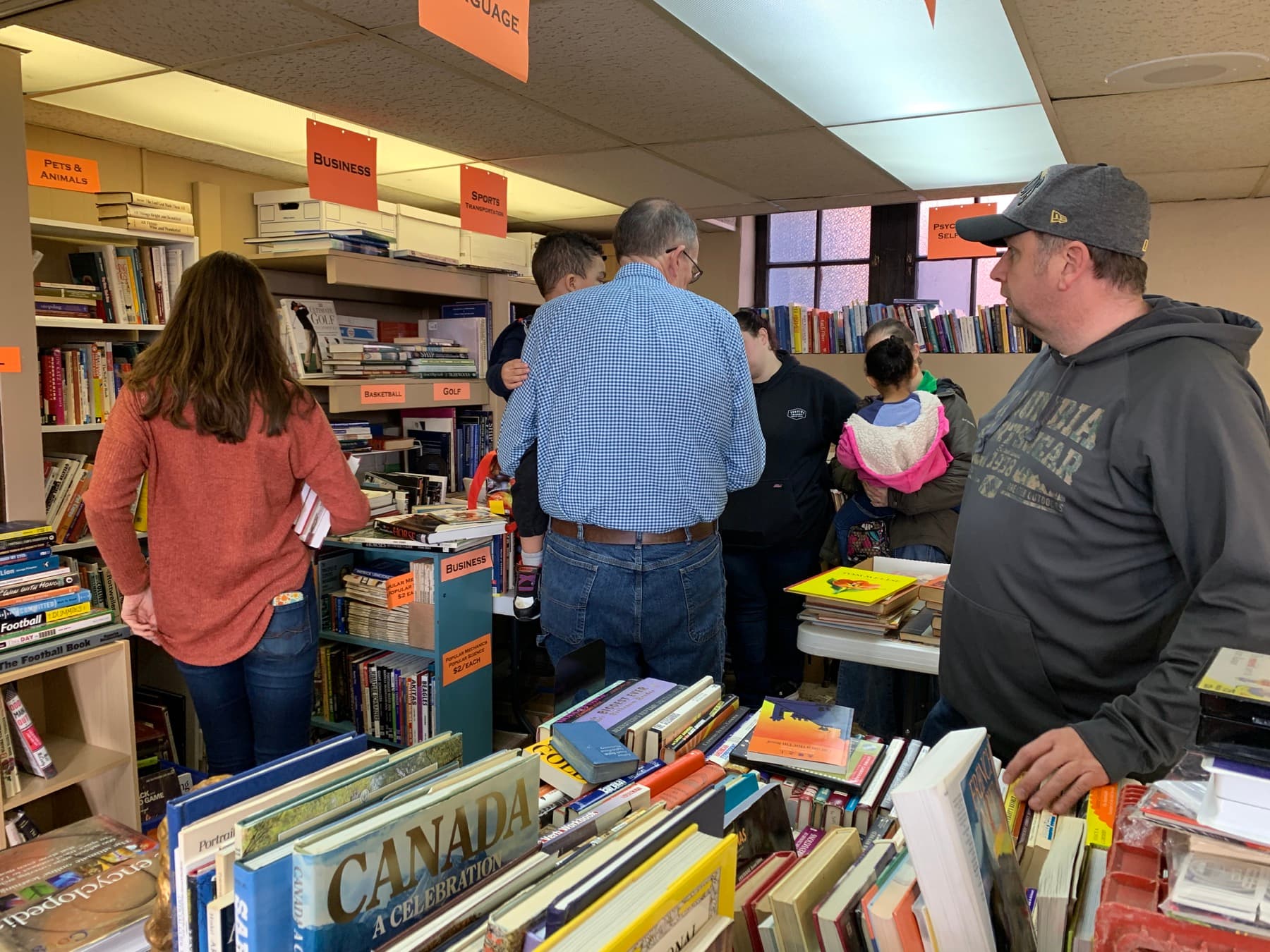 Visitors browsing books at the St. Andrew's book fair